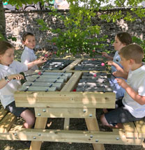 Musical Rocks - children playing musical bench